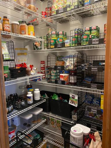 Here's a Look into the Corner Kitchen Pantry with Automatic Light and Adjustable Shelving.