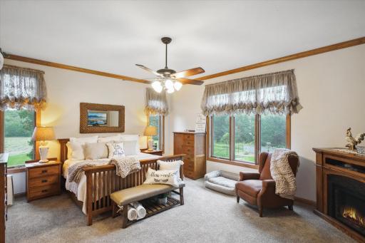 The Owner's Suite is Large Enough for Any-Sized Furniture. Wake Up to Beautiful Views or Sleep In with Room Darkening Blinds. Notice More Ceiling Fans, Crown Molding and Soft Carpeting with Uplevel Padding.