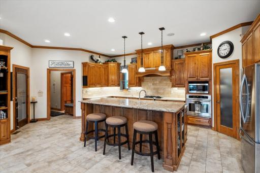 This is Simply an Amazing Kitchen! Caesarstone Countertops, Travertine Backsplash, Staggered Height Birch Cabinetry, a Corner Walk-In Pantry, Stainless Steel LG Appliances Including the Oven, Microwave and Door-In-Door Super Capacity Refrigerator...
