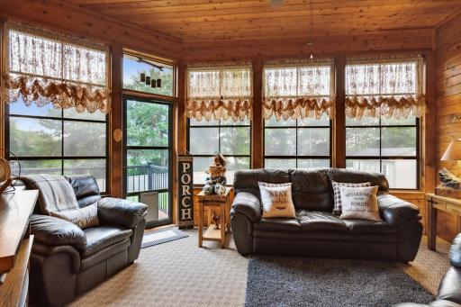 This 3-Season Porch Opens to the Deck (a Doggy Door, too!). Special Weather Master Windows Have a Durable View Flex Vinyl Glazing, and Slide Up to Open from the Bottom or Down from the Top to Allow Up to 75% Ventilation, or They Can also be Removed.