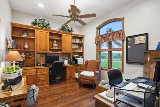 This Executive Office is Just Inside the Entrance to the Home and Offers Built Ins with File Cabinet Size Drawers and Sweeping Views of the Grounds and Countryside.