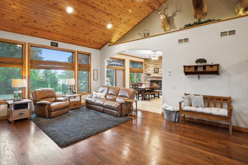 All but the Carpeted Rooms on this Level have In-Floor Heat, One Wall Control Here on the Way to the Dining Area. Large Windows Throughout Offer Great Views and All Have Solar Shield Window Tint. All Treatments and Blinds Stay...but Not the Mounts!