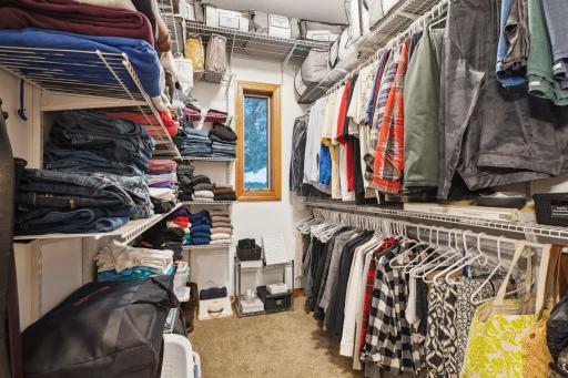 Here's a Closer Look at the Owner Suite Walk-In Closet with its Pocket Door, Adjustable Shelves and Organizers and Another Window for Natural Light.