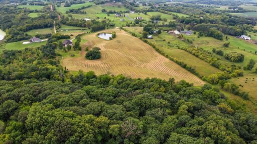 Such a Rare Find: 27 Acres That's Approx 5 Acres of Oaks and Other Hardwoods, Approx 17 Acres of Certified Organic Tillable Land and the Approx 5 Acre Homesite. Visitors Will See that Big Round Hay Bales Now Dot the View from the Front of the Home!