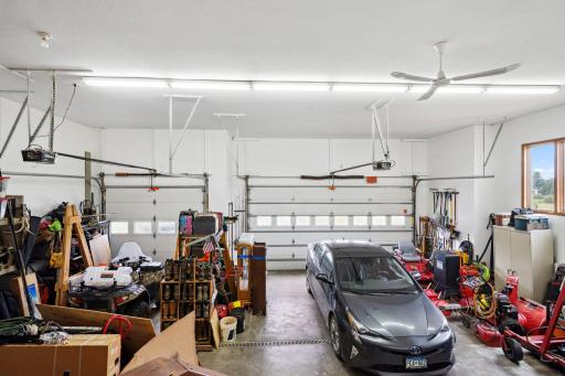 Past the Laundry Room is the Big 3-Car Garage with 9 ft Tall Doors, In Floor Heat and Floor Drain. The Double Door Side Measures Approx 21 ft Wide x 27.5 ft Deep, with a 18 ft door. The 3rd Stall Door is 9 ft Wide and Approx 12 ft Wide x 30 ft Deep.