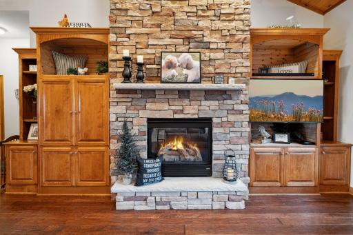 One Focal Point of this Great Room is the Stone Gas Fireplace, 1 of 3 in the Home and 1 of 2 on This Level. Notice the Eco Ceiling Fans in Many of the Rooms and the Abundance of Built Ins, Over-Sized Closets and Storage Options Always Close By.