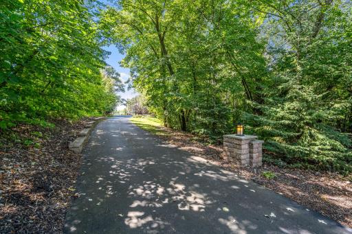 Picturesque driveway offers additional parking