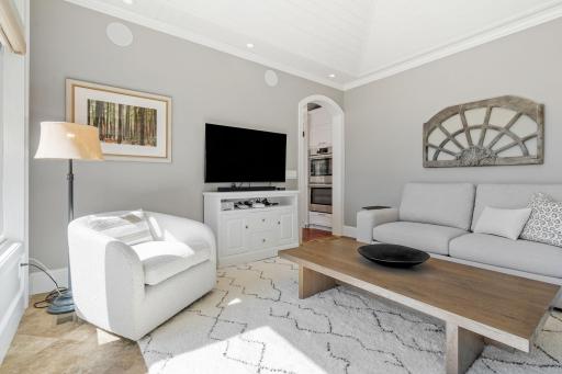Wood enameled vaulted ceilings w/ fan & tile flooring