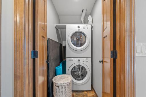 Additional laundry closet with stackable washer and dryer