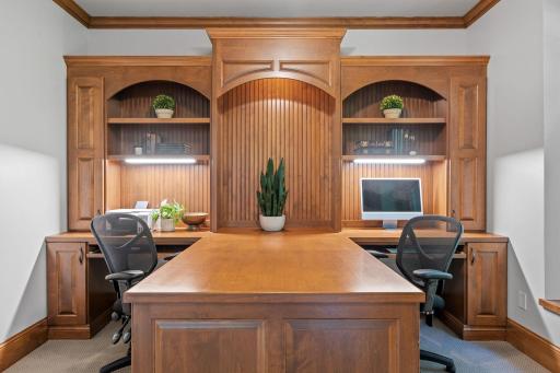 Custom built-in dual workstation offers open display shelving with accent lighting, storage, under cabinet task lighting and bead-board accents