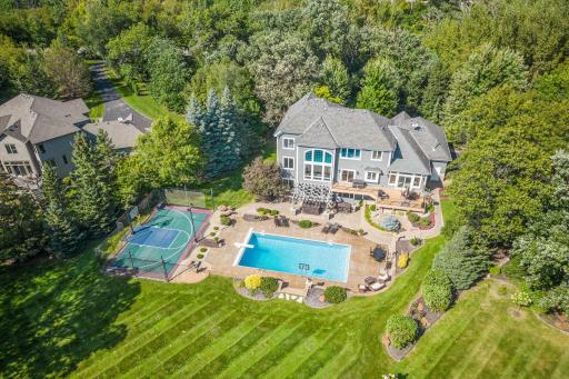 Meticulously cared for home sits on 1.88 acre lot that is carefully placed on Legends Lake and offers stunning views of the golf course's signature hole #13