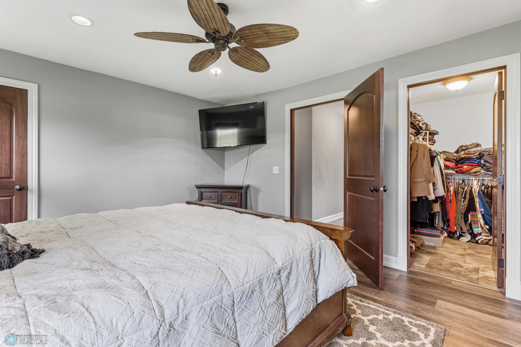 Primary Bedroom with two closets including one walk-in and private ensuite bath