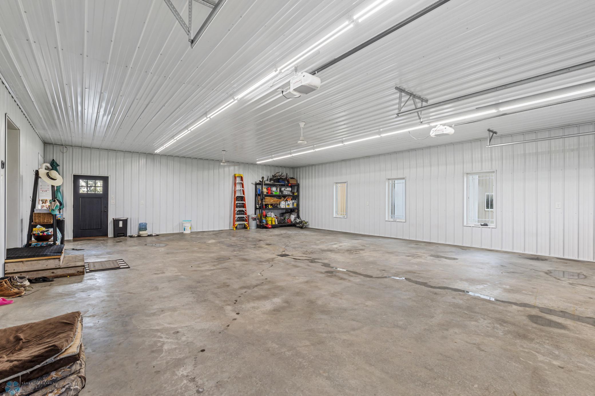 4 stall attached garage with in-floor heat and floor drain