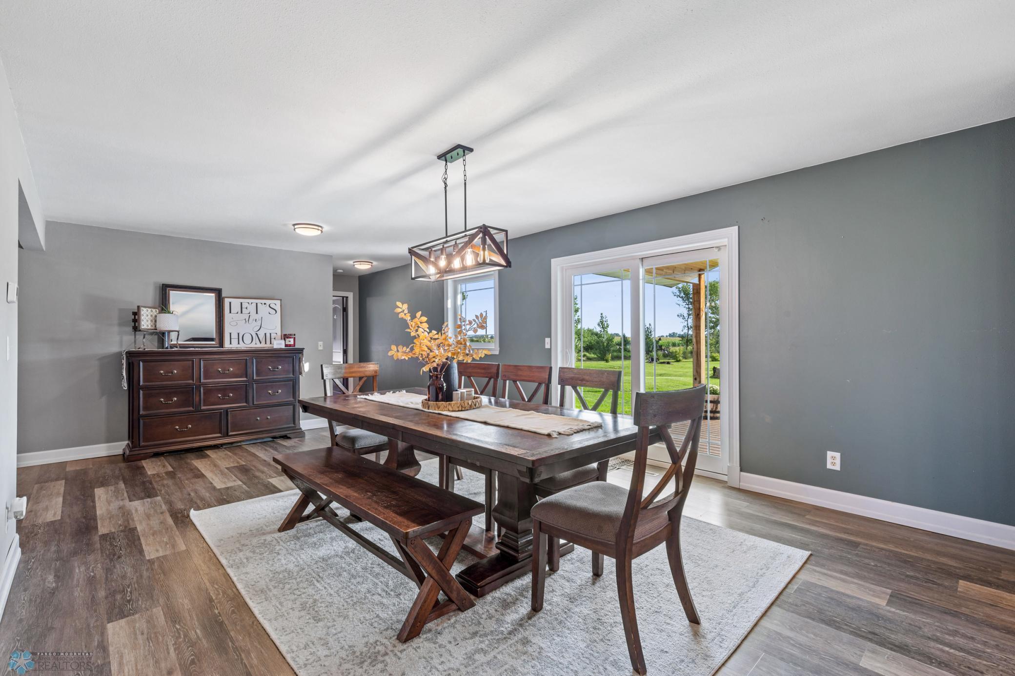 Dining Area with patio door out to large covered maintenance free porch