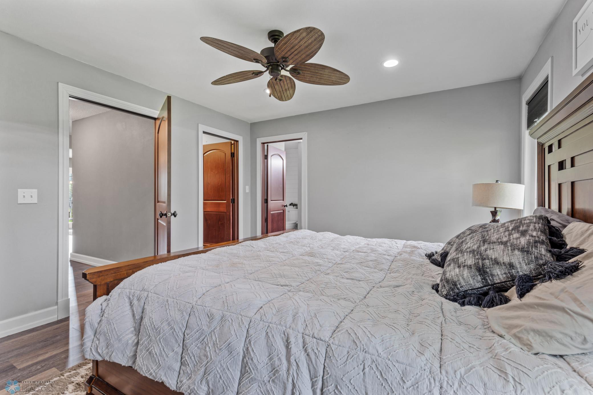 Primary Bedroom with two closets including one walk-in and private ensuite bath