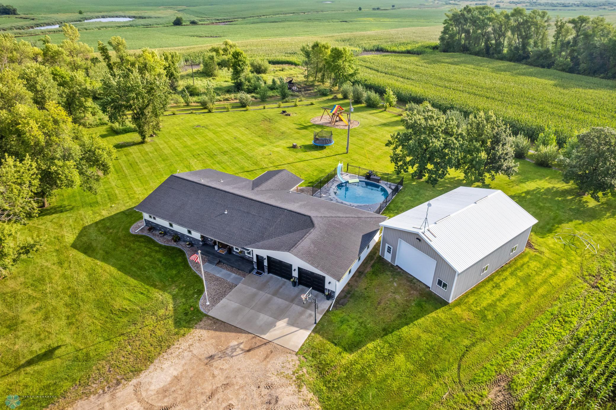 5 Bedroom 4 bathroom home with 4 stall heated garage and 48 x 32 Foltz Building