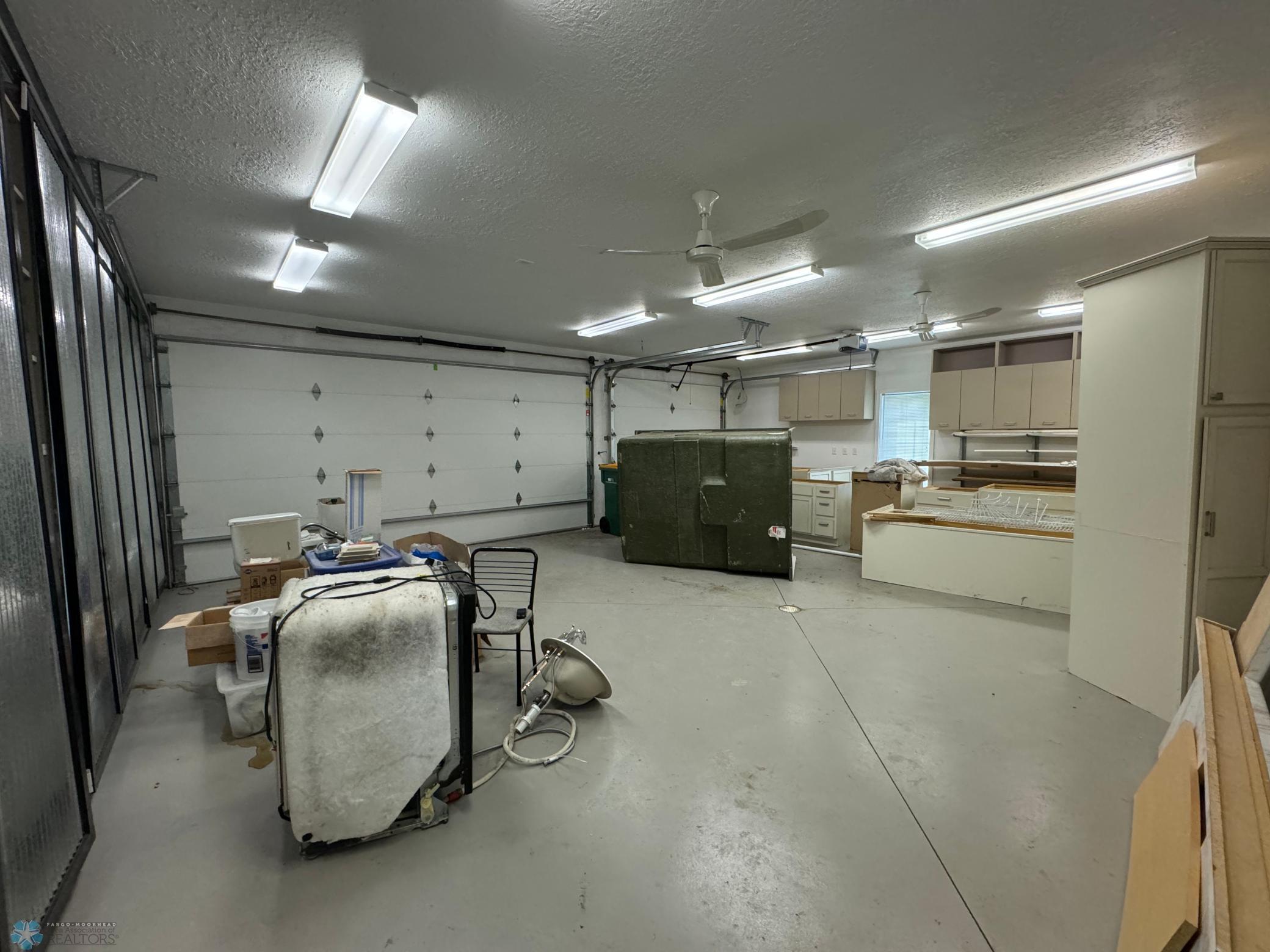 Interior of Garage - extra cabinetry & building materials included.