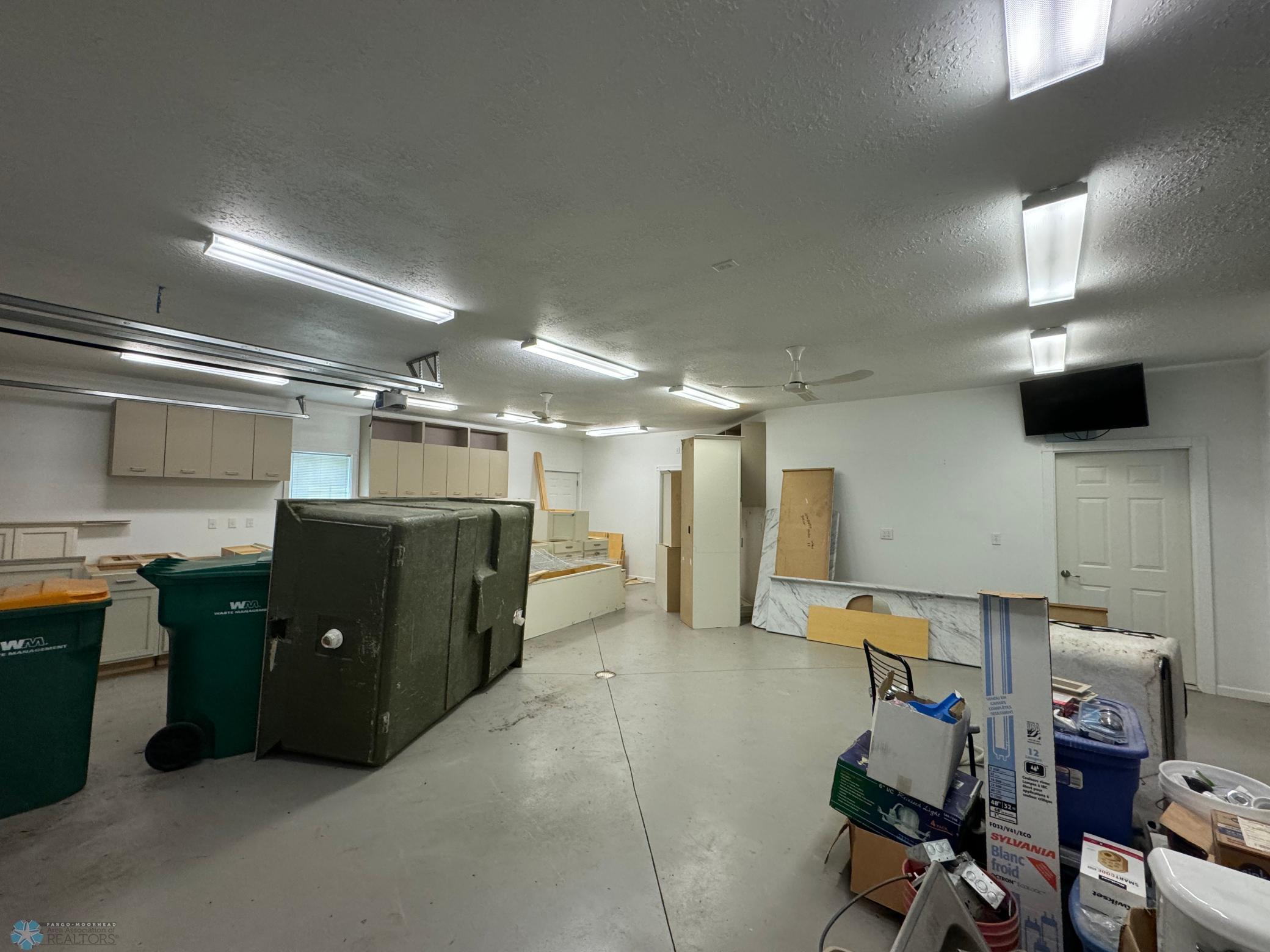 Interior of Garage - extra cabinetry & building materials included.