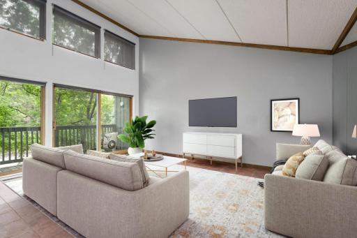 Enjoy beautiful nature views and tons of natural light in this bright and spacious family room featuring soaring vaulted ceilings