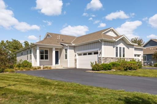 Experience nature and privacy in this unique lakefront end-unit townhome with stunning views of Lake Augusta.