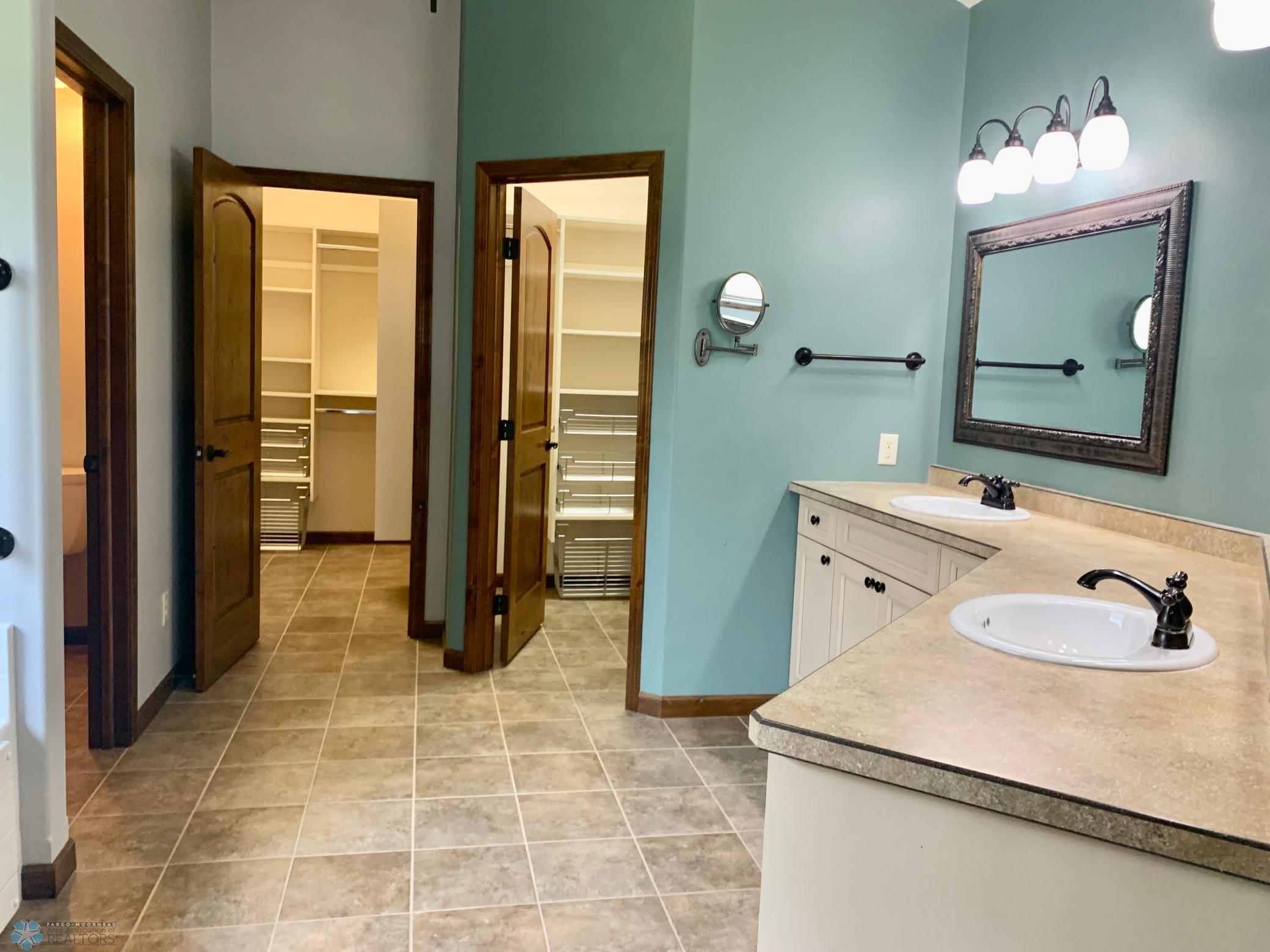 2 walk in closets w/custom shelving