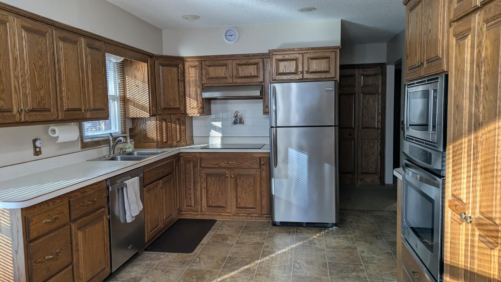 Beautiful oak cabinetry plus induction cook top in kitchen