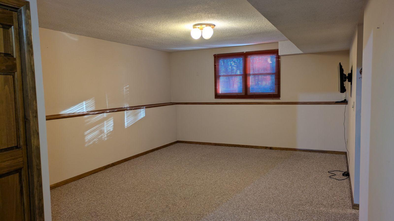 Family Room on other side of Amusement Room. Lots of options for entertainment on this level! Both of these rooms face the south and get lots of natural light too.