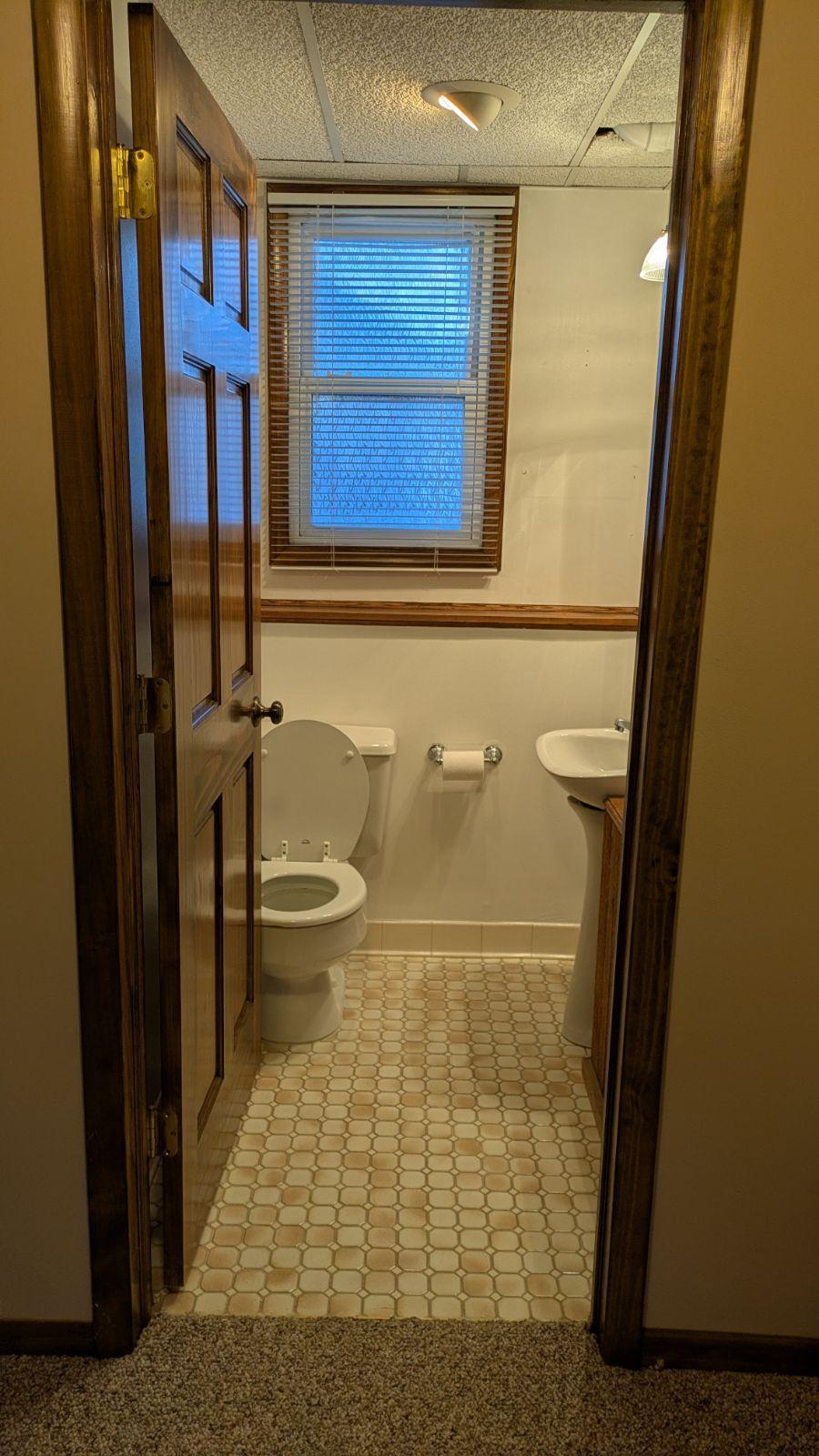 Lower level 1/2 bath with tiled floor!