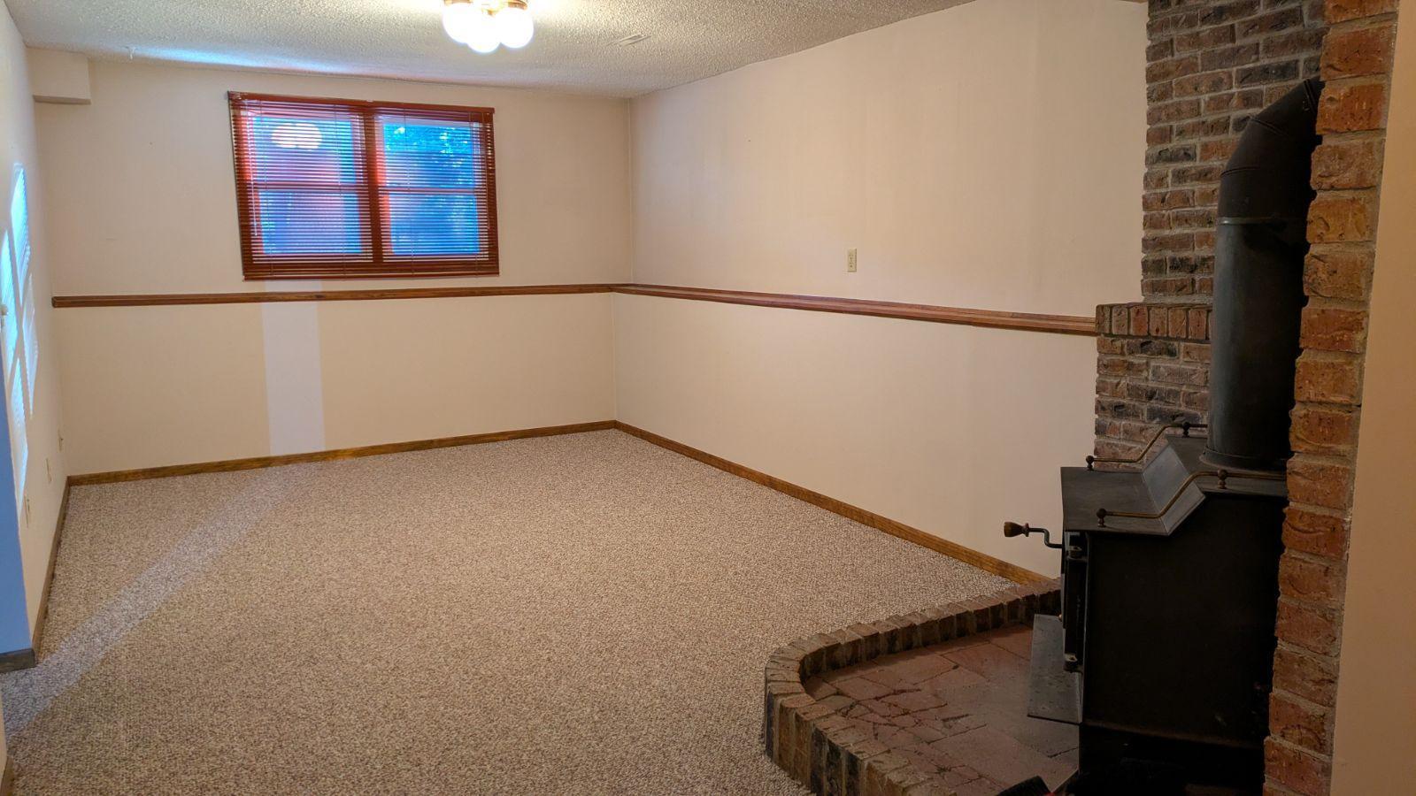 Add'l view of spacious Amusement Room. Imagine being snuggled up on the couch; the fireplace on; and watching a movie or the game!