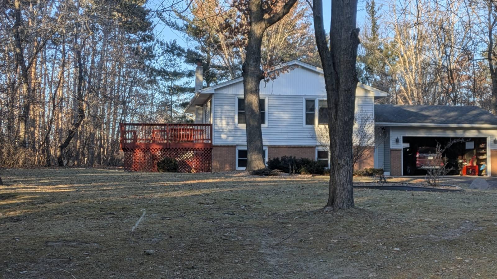 Huge side deck with railing & gate. Surrounded by trees creating lots of privacy and wildlife sitings.