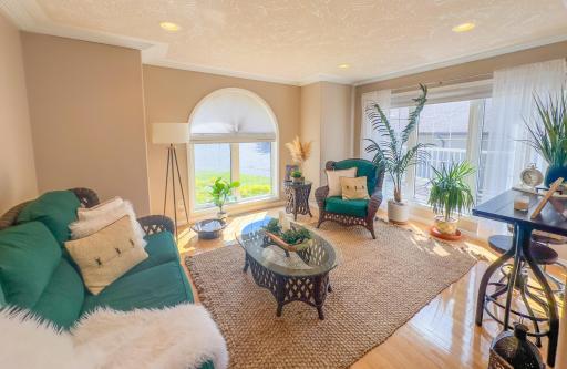 Walk into the sun room off of the kitchen and be greeted with wonderful views and lots of sun light.