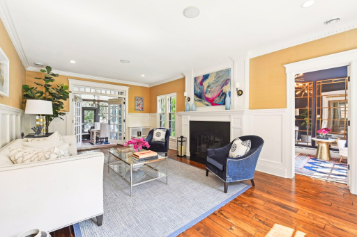 Custom crown molding and wainscoting can be found throughout the home.