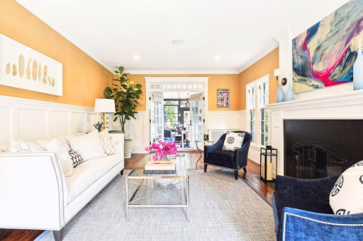 This formal living room opens to the bright and airy sunroom.