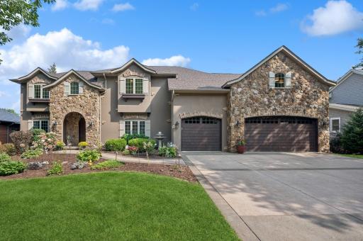 Street side- Stamped concrete driveway and beautiful landscaping