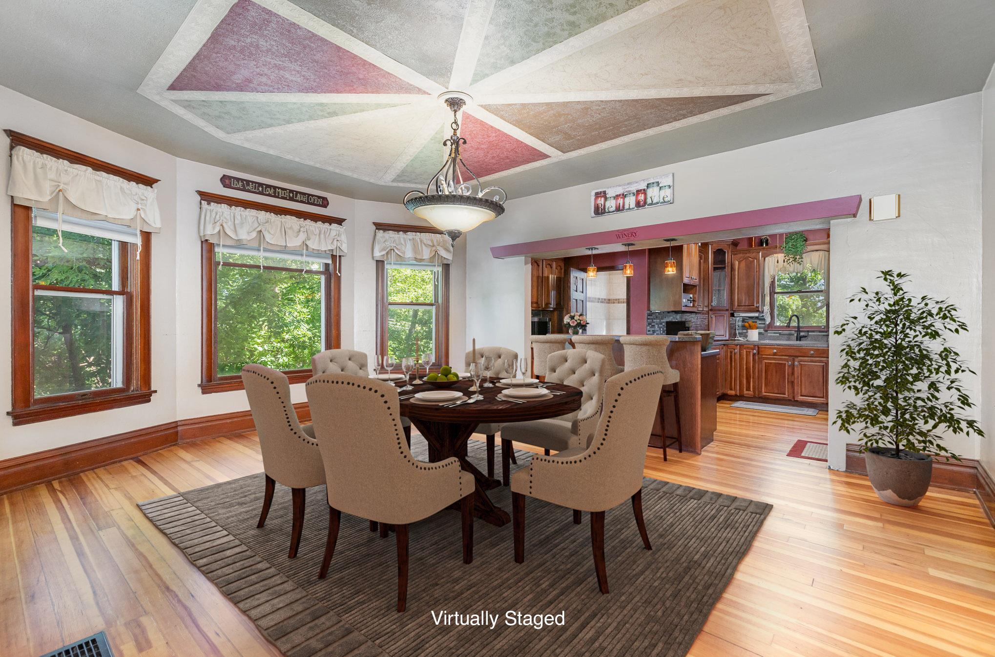 Virtually staged dining and kitchen great room
