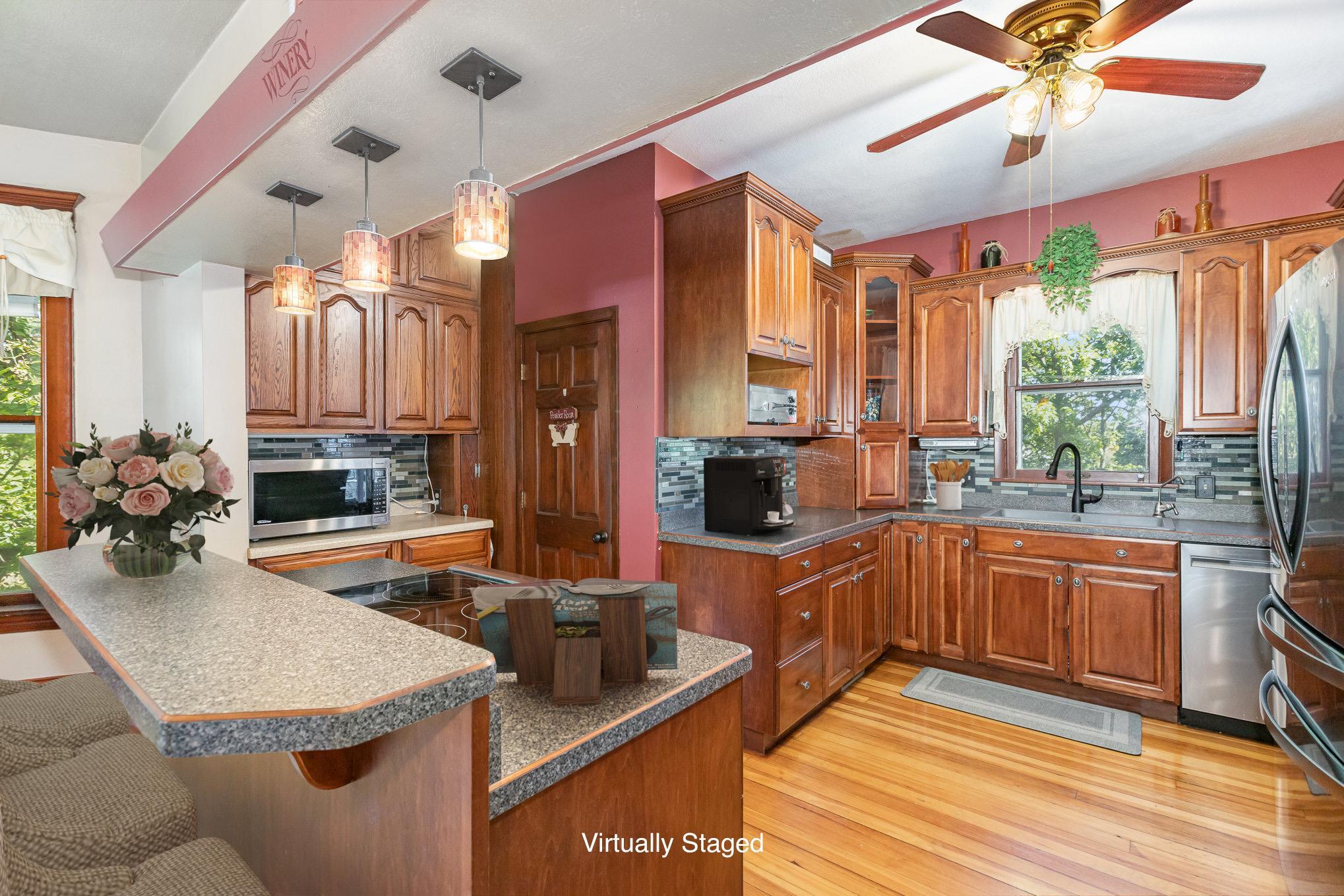 Grand open kitchen with stainless steel appliances