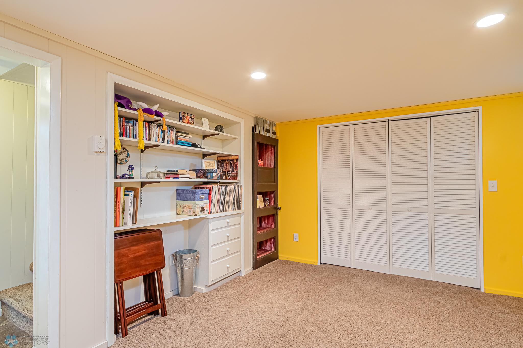 Lower Level Family Room - Lots of storage and shelves