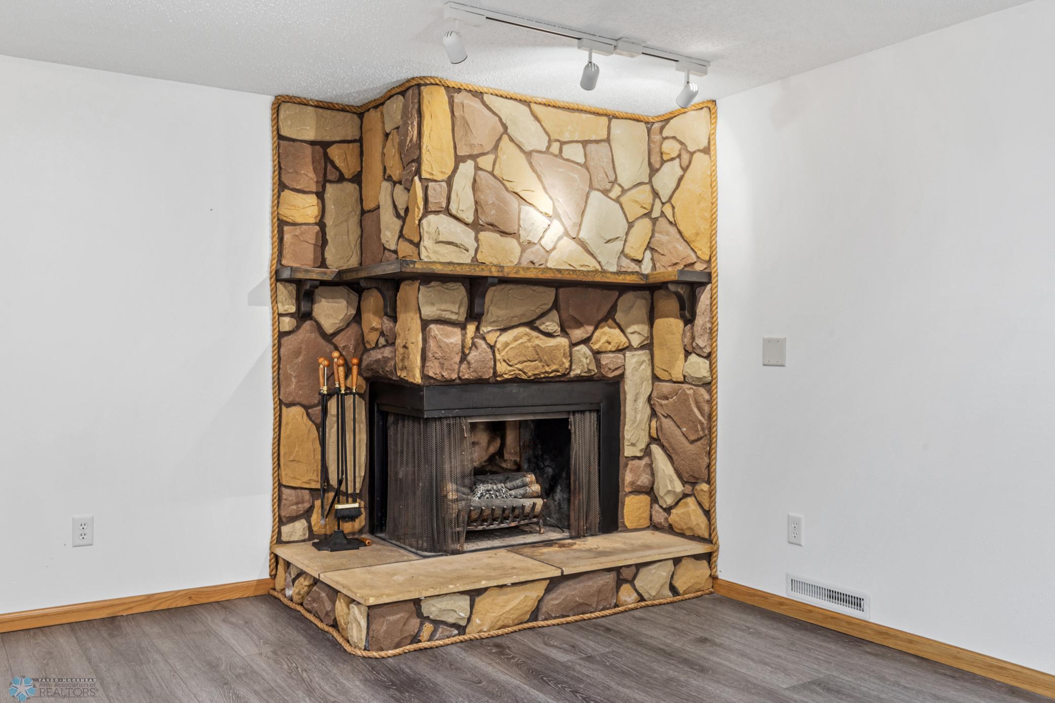 Fireplace: wood-burning w/ electric log insert