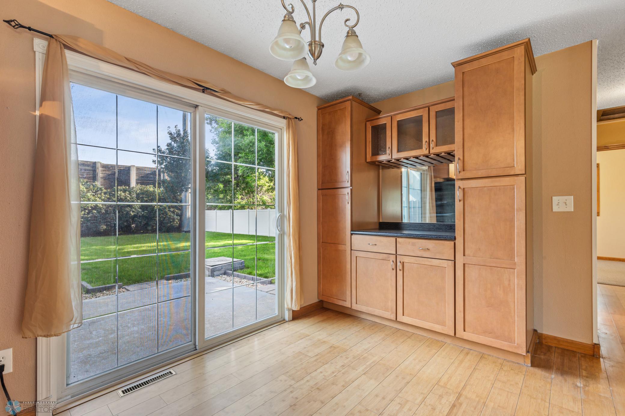 Dining with built-ins and patio door