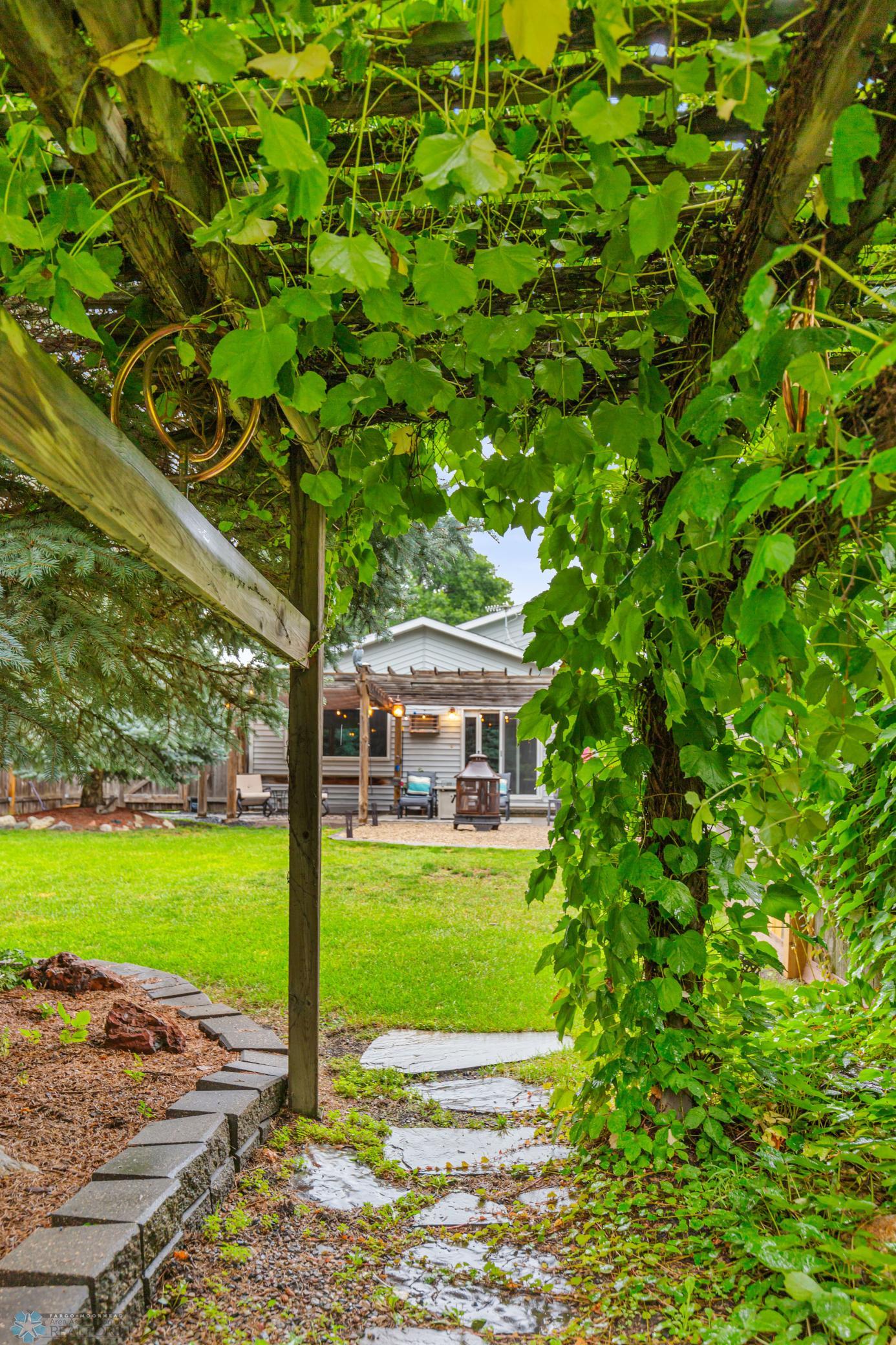 view of backyard from gate to greenspace