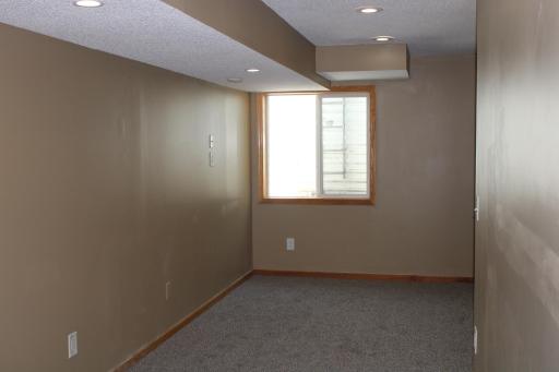 Space to add the 4th bedroom. Egrees window, carpeting and bathroom already in place