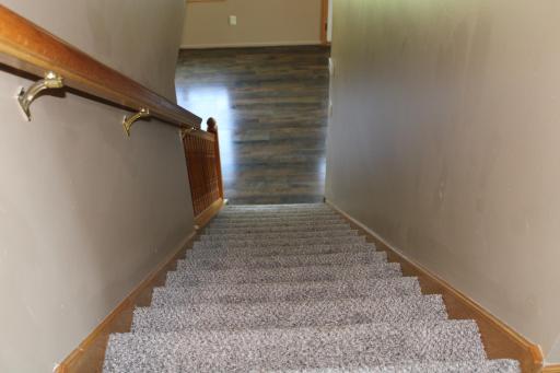 Stairway view from the upper level with new carpeting