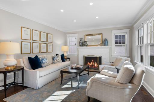 The living room with a wood burning fireplace