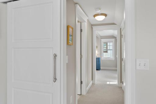 The hallway linking the shared bath to bedrooms 2 and 3
