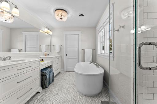 The primary bath, with double vanities and separate tub and shower