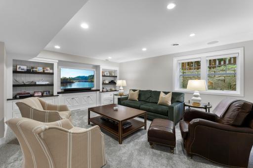 The lower level media room with built-ins