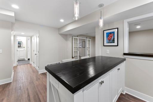 A view from the bar to the lower level 3/4 bath
