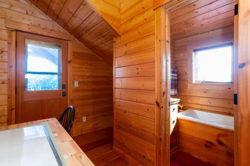 Flex space/office leads to upper covered deck