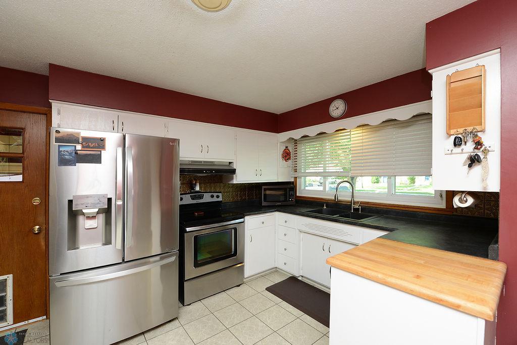 Large kitchen window/stainless steel appliances