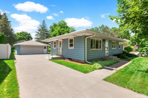 Charming rambler with great curb appeal. Concrete driveway, two car detached garage, maintenance free siding, razor sharp and move in ready!